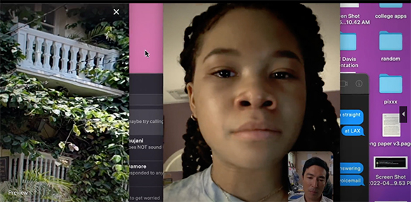 A video call interface showing a person's face, a building with vines, and a computer desktop.
