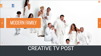 Cast members of Modern Family posing in white outfits against a white background.