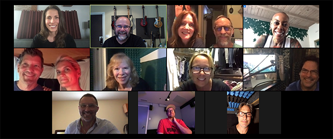 Twelve diverse individuals appearing in a grid of video call windows during a virtual meeting.