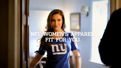 A woman in a blue NFL t-shirt stands in a doorway with text overlay reading NFL Women's Apparel, Fit For You.