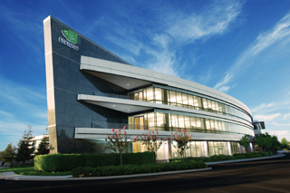 A multi-story modern office building with curved glass windows and a dark architectural fin under a blue sky.