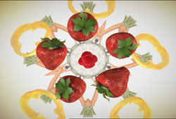 A radial pattern of strawberries, yellow bell pepper rings, and carrot slices on a light background.