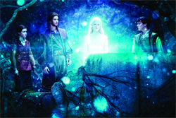 Three people stand in a dark, glowing blue forest surrounding a bright, ethereal white figure.