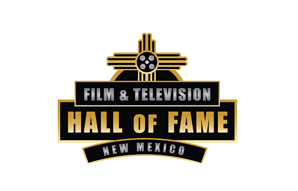 Gold and black logo for the Film & Television Hall of Fame New Mexico featuring a Zia symbol and film reel.