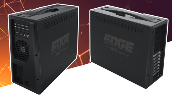 Two black rectangular computing hardware units with handles and ventilation slots against a dark background.