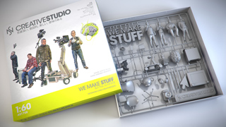 A model kit box labeled 'CREATIVE STUDIO' next to an open tray of grey plastic miniature parts.