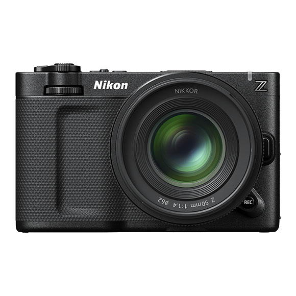 A black Nikon compact camera with a large lens centered on the body.