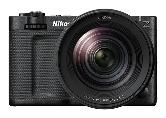 A black Nikon mirrorless camera with a large Nikkor zoom lens attached.
