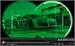 A green digital HUD overlaying a sports car in a garage setting.
