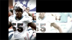 Football player wearing a white jersey with number 55 and a helmet, looking forward.