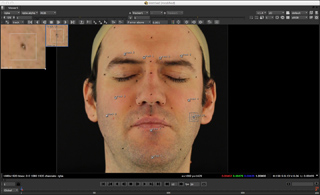 Software interface showing a close-up of a man's face with blue and red tracking points overlaid.