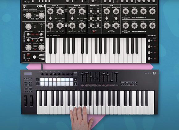 A black electronic synthesizer with various knobs, sliders, and white keys.