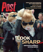 Two hamsters in suits and sunglasses, one adjusting its tie, walk a red carpet with blurred people in the background.