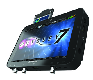 A black Odyssey 7 monitor displaying a blue graphic with a media card inserted into the top slot.