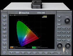 OmniTek OTM 1000 device displaying a colorful chromaticity diagram on its screen.