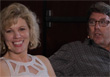 A smiling blonde woman in a white top and a man with glasses in a dark shirt.