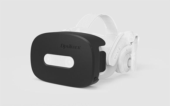 A black OptiTrack sensor module attached to the front of a white Vive virtual reality headset.