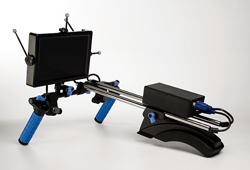 A black computer monitor mounted on a silver metal and blue adjustable articulated stand.
