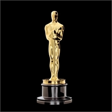 A gold Academy Award statuette standing on a black circular base against a solid black background.