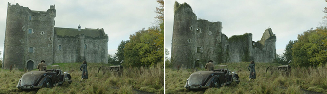 A vintage car and two people in a field facing a large, weathered stone castle ruin under a cloudy sky.