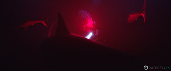 A scuba diver with a bright flashlight is surrounded by several sharks in dark, deep red water.
