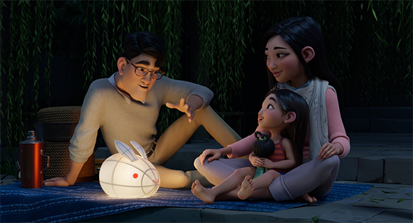 An animated family sits on a mat at night, looking at a glowing rabbit-shaped lantern.