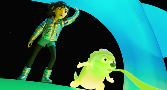 An animated girl in a silver jacket looks down at a small, glowing green creature in a dark space.