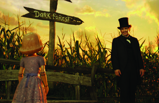 A young girl in a purple dress faces a man in a black suit and top hat in a cornfield at sunset.