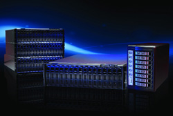 Three black server rack units with blue glowing lights arranged on a dark reflective surface.