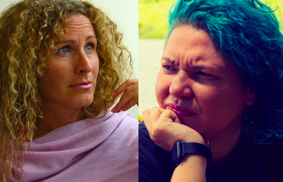 Two women side-by-side, one with blonde curly hair and one with blue curly hair, looking thoughtful.