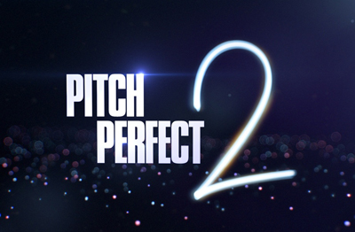 The words PITCH PERFECT in white block letters next to a large, glowing white number 2 against a dark, bokeh background.