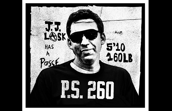 Black and white portrait of a man in sunglasses and a P.S. 260 t-shirt against a textured background.