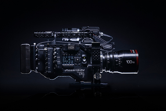 A black Panavision DXL 2 cinema camera with a large lens against a dark background.