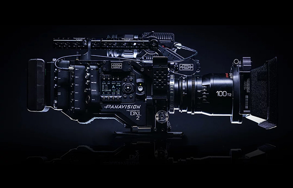 A black Panavision DXL 2 digital cinema camera with a large lens, set against a dark background.