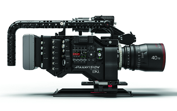 Side profile of a black Panavision Millennium DXL cinema camera with a large lens on a white background.