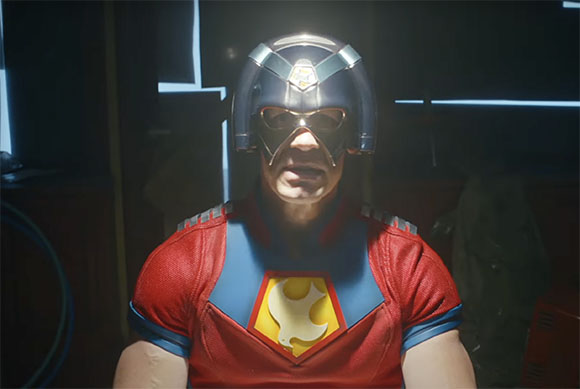 A man wearing a red and blue superhero suit and a silver helmet with a gold visor.