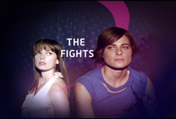 Two women looking forward against a dark purple background with the text THE FIGHTS.