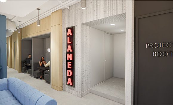 Modern office hallway featuring wooden work pods, a blue sofa, and a vertical red neon sign reading ALAMEDA.