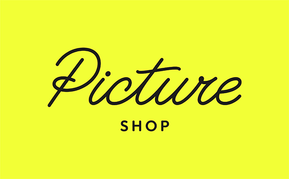 Black cursive text reading 'Picture' above the word 'SHOP' in sans-serif font on a bright yellow background.