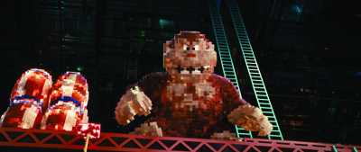 A massive, glowing pixelated gorilla figure constructed from red and brown lights in a dark setting.