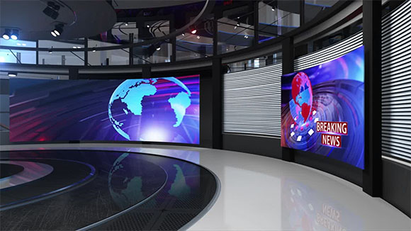 A news studio featuring large digital screens displaying a globe and breaking news graphics.