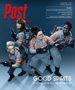 Four women dressed as Ghostbusters, wearing proton packs and holding ghost-catching equipment, stand ready for action.