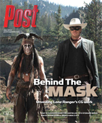 Two men in costume, one with face paint and headdress, the other in a cowboy hat and sunglasses, stand in a wooded area.