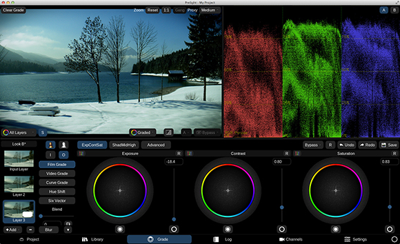 Video editing software interface with a snowy lake scene, color vectors, and color wheel adjustment tools.