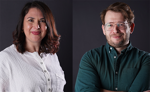 A woman in a white textured shirt and a man in a green button-down shirt pose against a dark background.