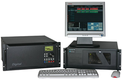 Computer workstation with a monitor displaying data, a keyboard, a mouse, and two black hardware components.