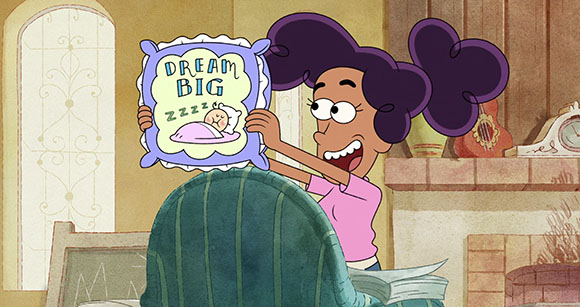 Animated girl with dark curly hair holds a light blue pillow with the words 'DREAM BIG' written on it.