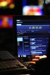 A close-up of a computer screen showing video editing software with a digital timer and timeline.