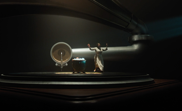 A woman in a white dress stands with arms raised next to a small figure in a tub under a large industrial pipe.