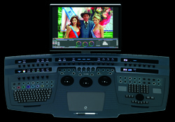 A video editing control surface with a monitor showing a colorful film scene.
